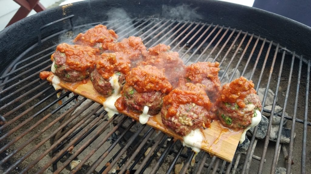 smoked meatballs on a cedar grilling plank