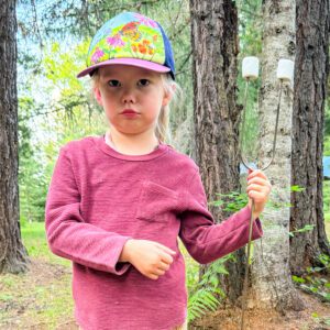 Child roast marshmallows campout